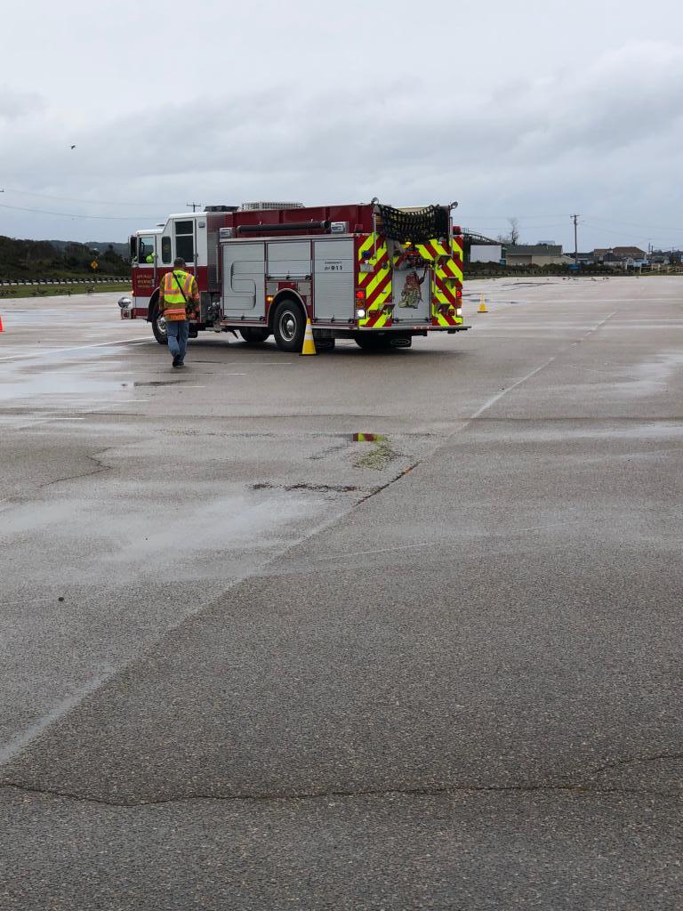 Captain Deniger instructs a driver of Hope Valley engine 912 at the Southern League's EVOC class at Misquamicut State Beach in October of 2018